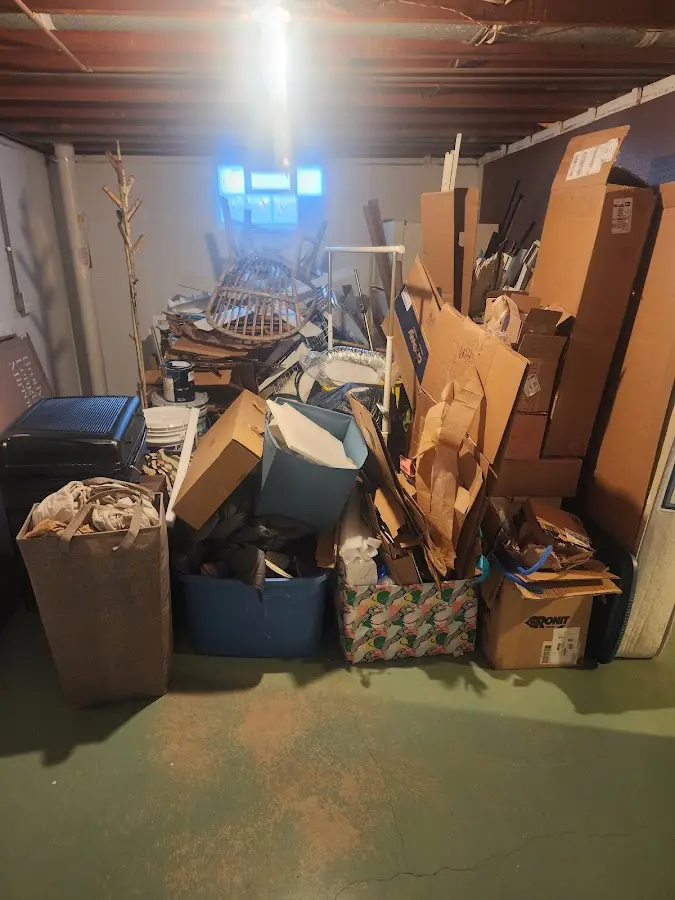 Roll-off dumpster container at job site for 8 Yard Dumpster Rental in Hillsdale